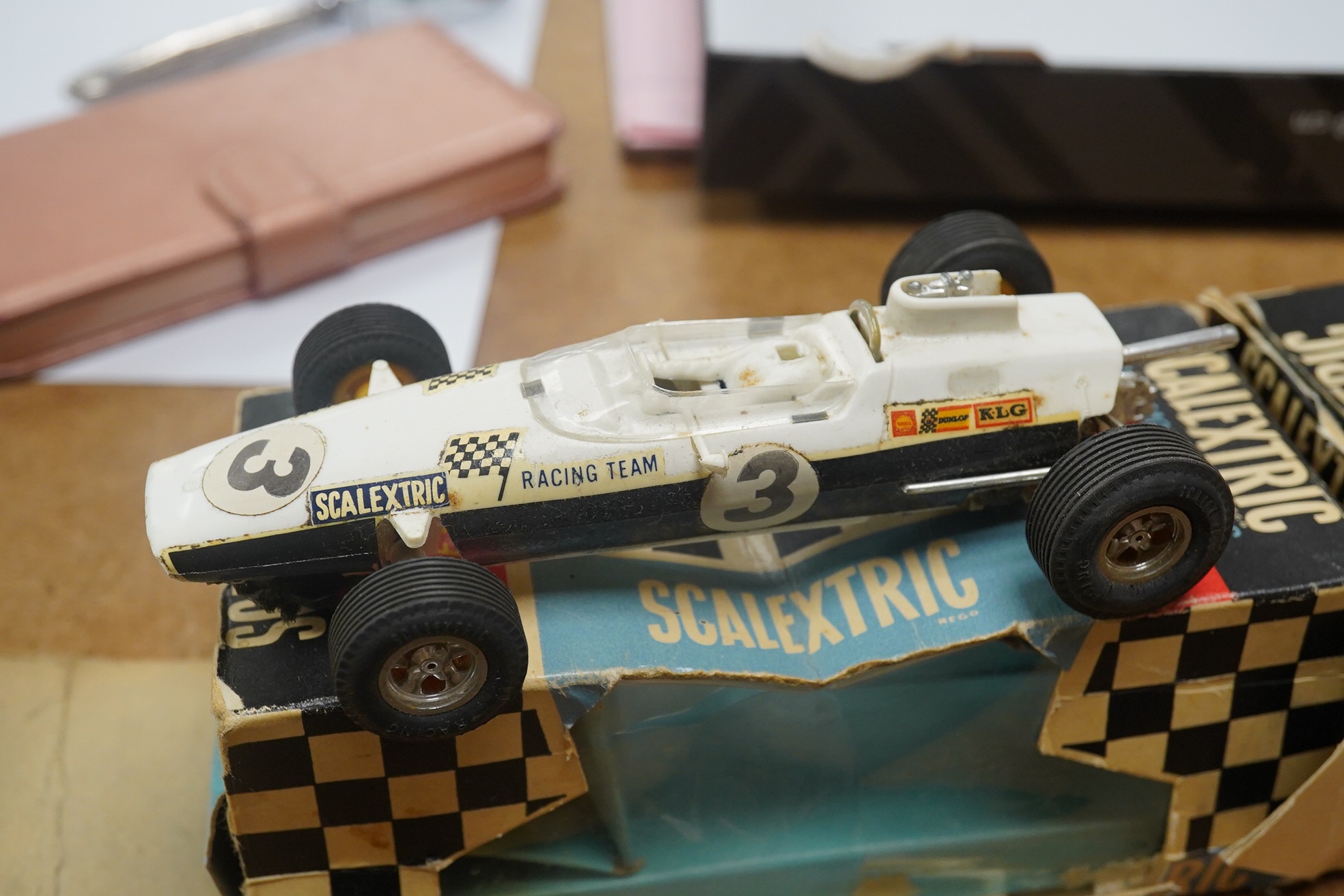 Two boxed 1960s Scalextric ‘race-tuned’ racing cars; a Lotus Indianapolis GP (C8) and a Scalextric Team Car (C19), both with inner card trays. Condition - poor, restoration needed to cars and boxes.